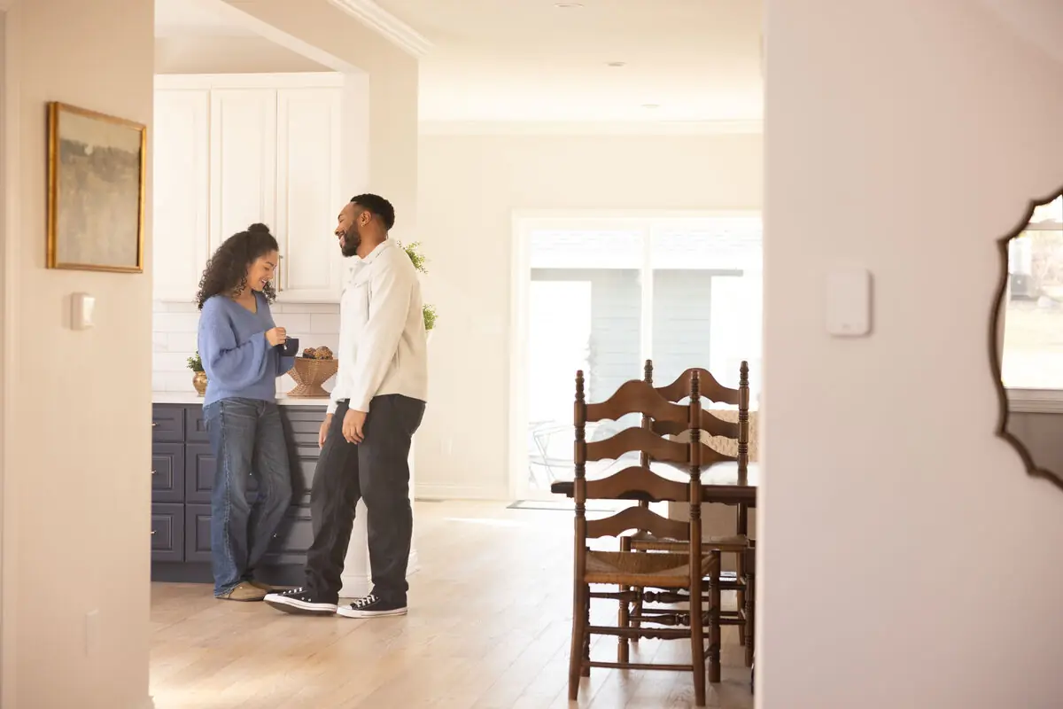 Couple talking in a bright kitchen